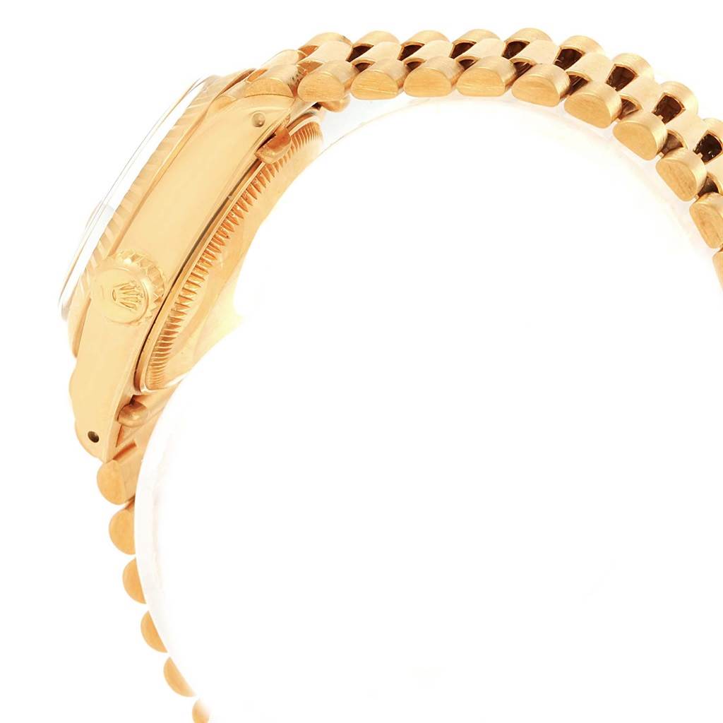 This image shows a side view of the Rolex President 6917 Women's Yellow Gold Brown Dial 6917 Women's Yellow Gold Brown Dial model watch, highlighting its gold case and bracelet.