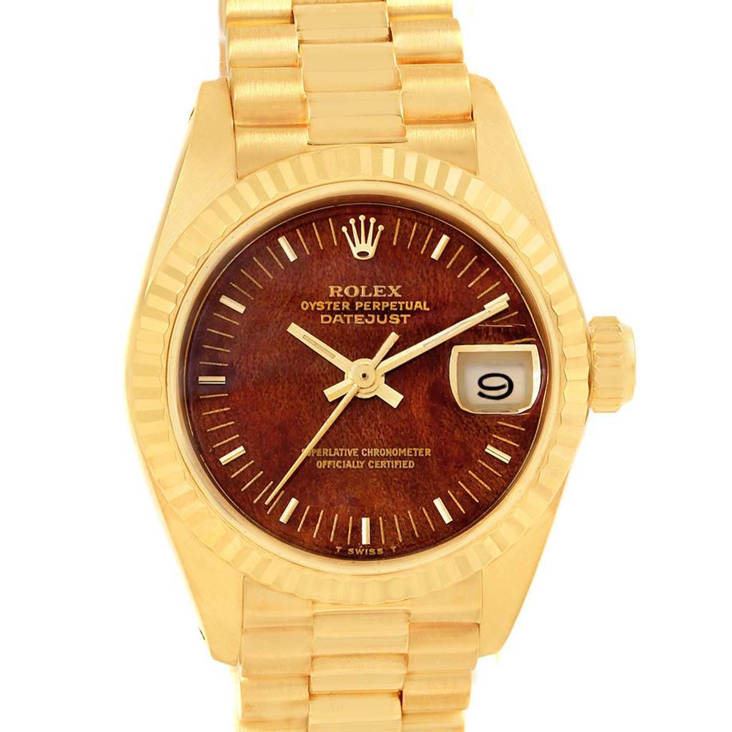 This image shows a frontal view of a Rolex President 6917 Women's Yellow Gold Brown Dial 6917 Women's Yellow Gold Brown Dial model watch, featuring the dial, hands, date window, and bracelet.