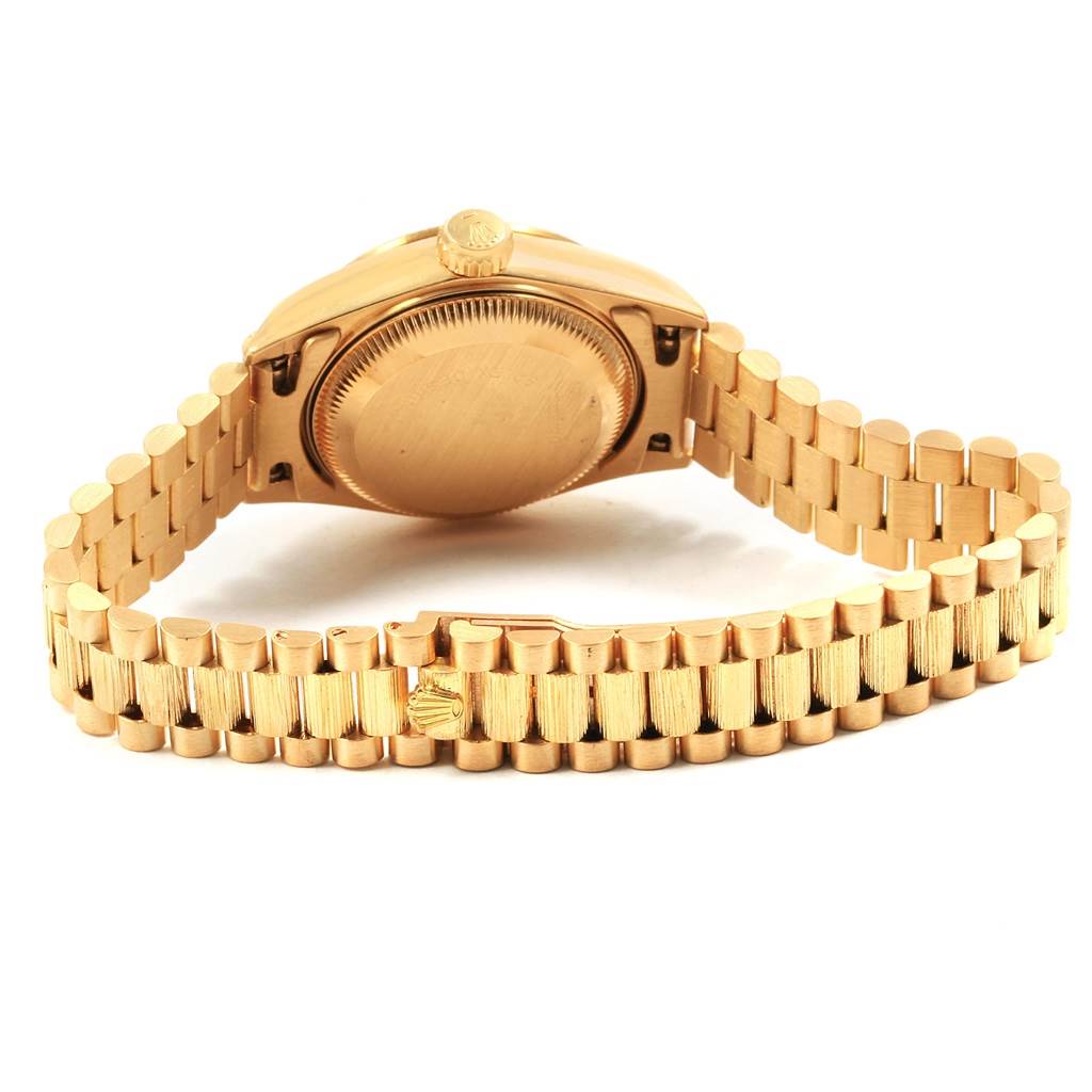 This image shows the back case and bracelet of the Rolex President 69278 Women
s Yellow Gold Champagne Dial 69278 Women
s Yellow Gold Champagne Dial model watch from a rear angle.