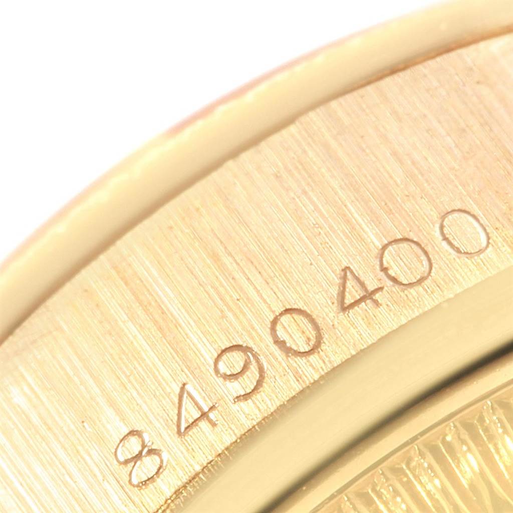 This close-up image shows a serial number engraved on the case of a Rolex President 69278 Women
s Yellow Gold Champagne Dial 69278 Women
s Yellow Gold Champagne Dial model watch.