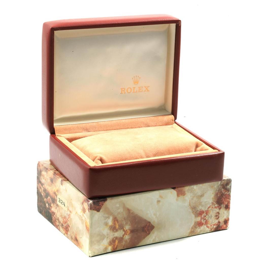 The image shows an opened Rolex President 69278 Women
s Yellow Gold Champagne Dial 69278 Women
s Yellow Gold Champagne Dial model watch box with its cushion inside.