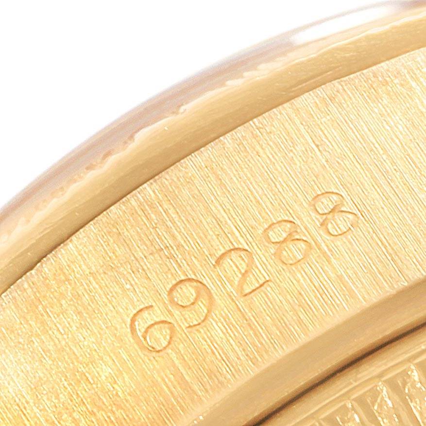 This close-up image shows the engraved reference number on the bezel of a Rolex President 69038 Women's Yellow Gold Champagne Dial 69038 Women's Yellow Gold Champagne Dial model watch.