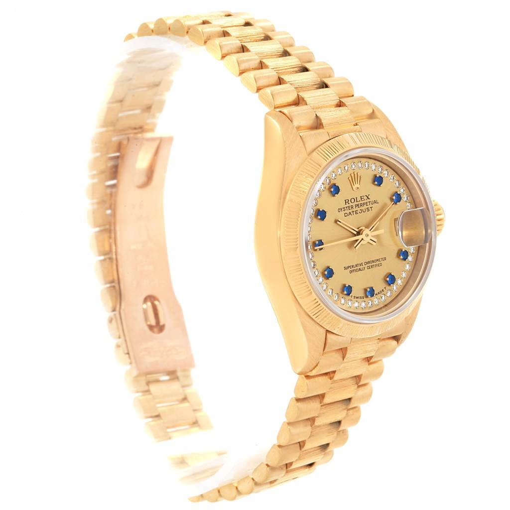 The image shows a side angle of the Rolex President 69038 Women's Yellow Gold Champagne Dial 69038 Women's Yellow Gold Champagne Dial model watch, displaying its bracelet, dial, and case.