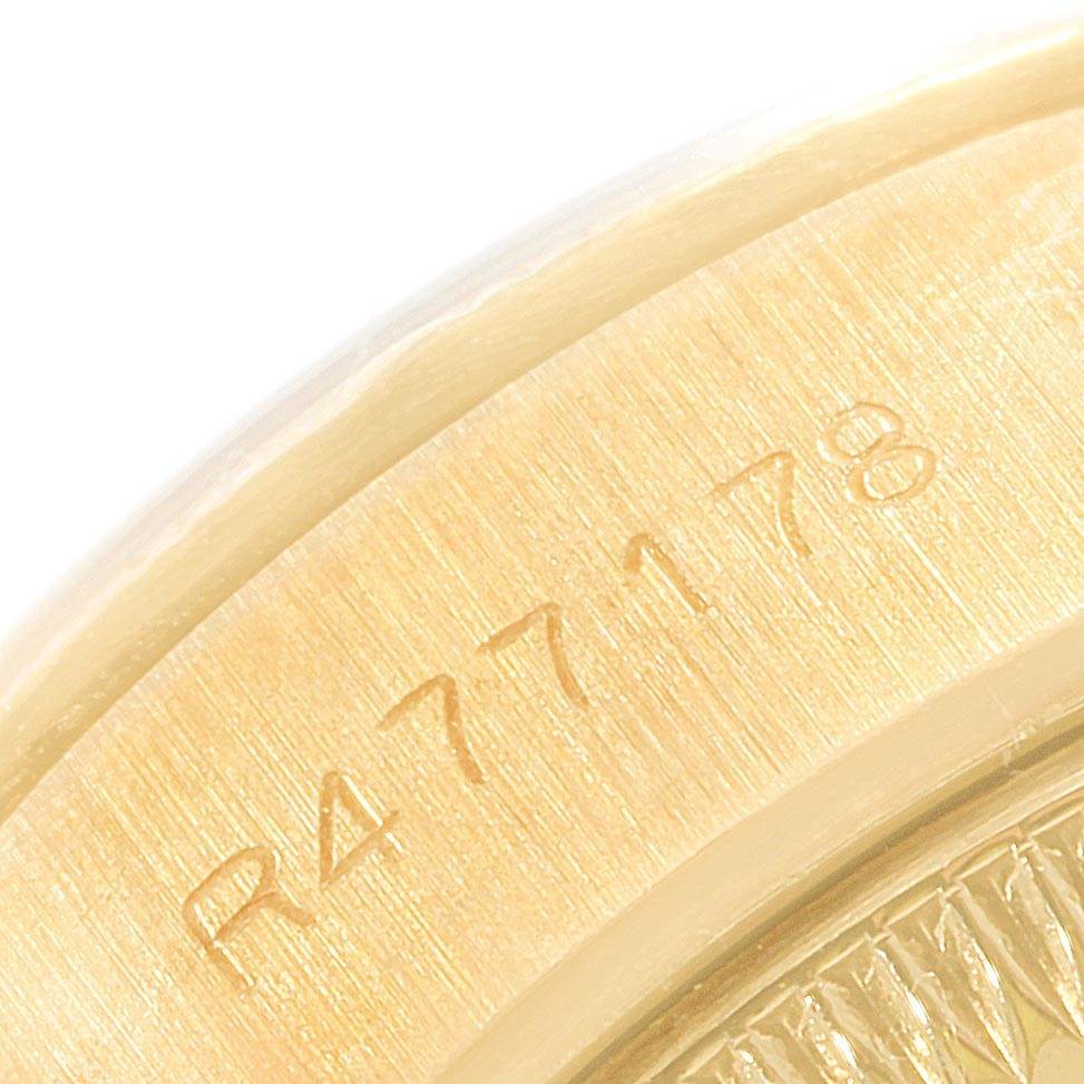 This is a close-up angle of the Rolex President 69038 Women's Yellow Gold Champagne Dial 69038 Women's Yellow Gold Champagne Dial model, focusing on its serial number engraving.