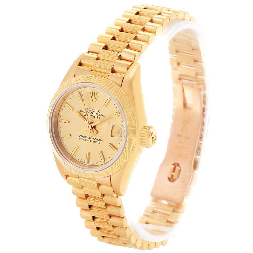 The image shows a side-angled view of a Rolex President 69278 Women
s Yellow Gold Champagne Dial 69278 Women
s Yellow Gold Champagne Dial model watch, highlighting the dial, bezel, crown, and bracelet.