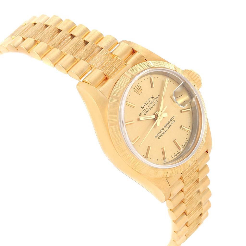 The image shows a partial side angle of the Rolex President 69278 Women
s Yellow Gold Champagne Dial 69278 Women
s Yellow Gold Champagne Dial watch, displaying the face, bezel, and bracelet.