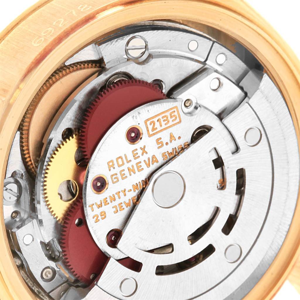 This image shows a close-up view of the internal movement of the Rolex President 69278 Women
s Yellow Gold Champagne Dial 69278 Women
s Yellow Gold Champagne Dial model watch, emphasizing its mechanical components.