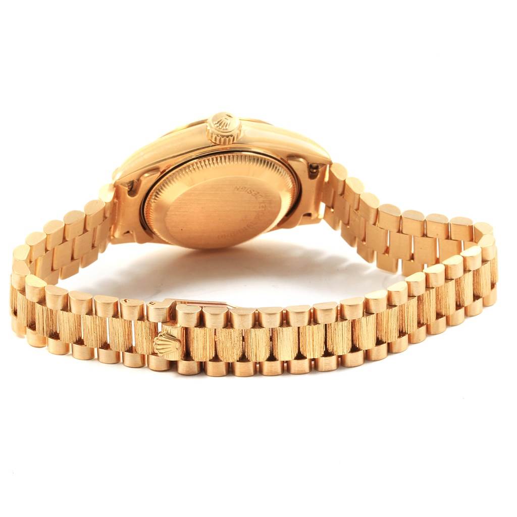 This image shows the back casing and bracelet of a Rolex President 69278 Women
s Yellow Gold Champagne Dial 69278 Women
s Yellow Gold Champagne Dial model watch, viewed from an underside angle.