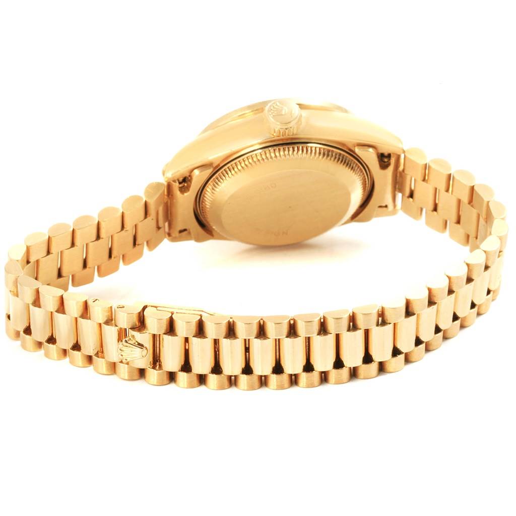 The image shows the back view of a Rolex President 69178 Women's Yellow Gold Champagne Dial 69178 Women's Yellow Gold Champagne Dial model watch, focusing on the case back and bracelet.