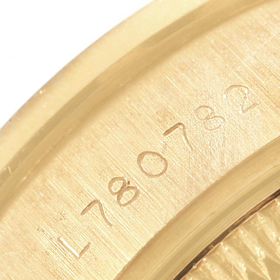 Close-up of the serial number on the gold casing of a Rolex President 69178 Women's Yellow Gold Champagne Dial 69178 Women's Yellow Gold Champagne Dial model watch.