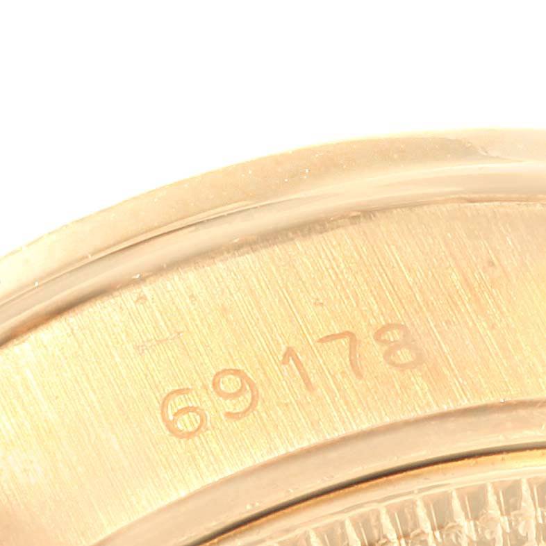 This close-up image shows the side of a Rolex President 69178 Women's Yellow Gold Silver Dial 69178 Women's Yellow Gold Silver Dial model watch, highlighting its engraved reference number "69178".