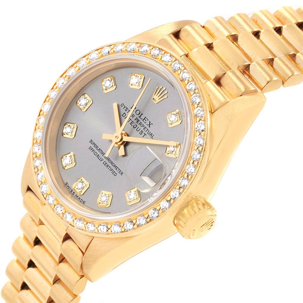 The image shows a Rolex President 69178 Women's Yellow Gold Silver Dial 69178 Women's Yellow Gold Silver Dial model watch at an angled close-up, highlighting its gold band, diamond-set bezel, and dial.