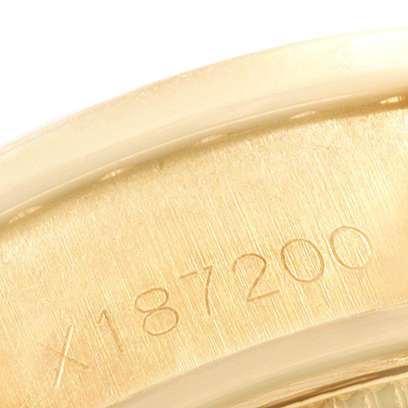 This image shows a close-up of the stamped serial number on the bezel of a Rolex President 69178 Women's Yellow Gold Blue Dial 69178 Women's Yellow Gold Blue Dial model watch.