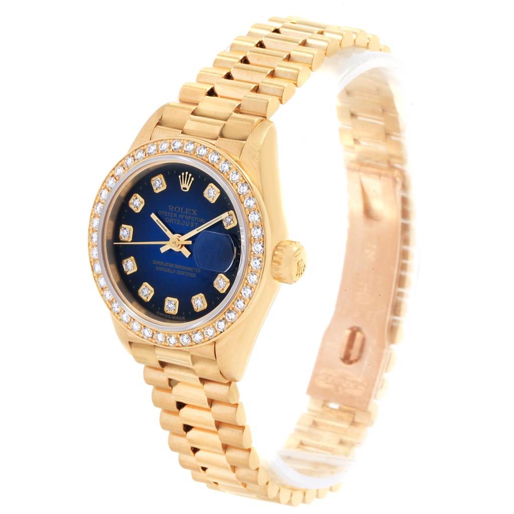 The Rolex President 69178 Women's Yellow Gold Blue Dial 69178 Women's Yellow Gold Blue Dial model watch is shown at an angled view, displaying its gold bracelet, blue dial, diamond hour markers, and bezel.