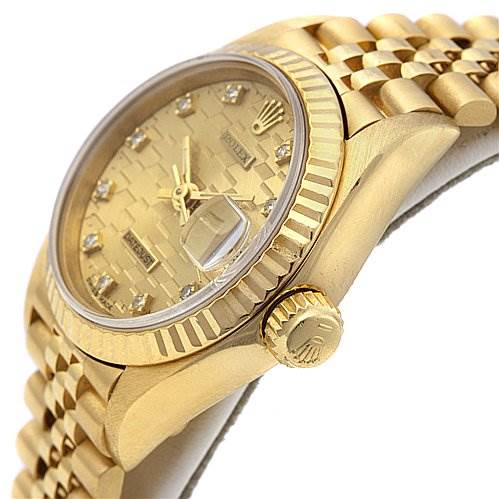 This image shows a side angle of the Rolex President 69178 Women
s Yellow Gold Champagne Dial 69178 Women
s Yellow Gold Champagne Dial model watch, highlighting the crown, bezel, case, and part of the bracelet.