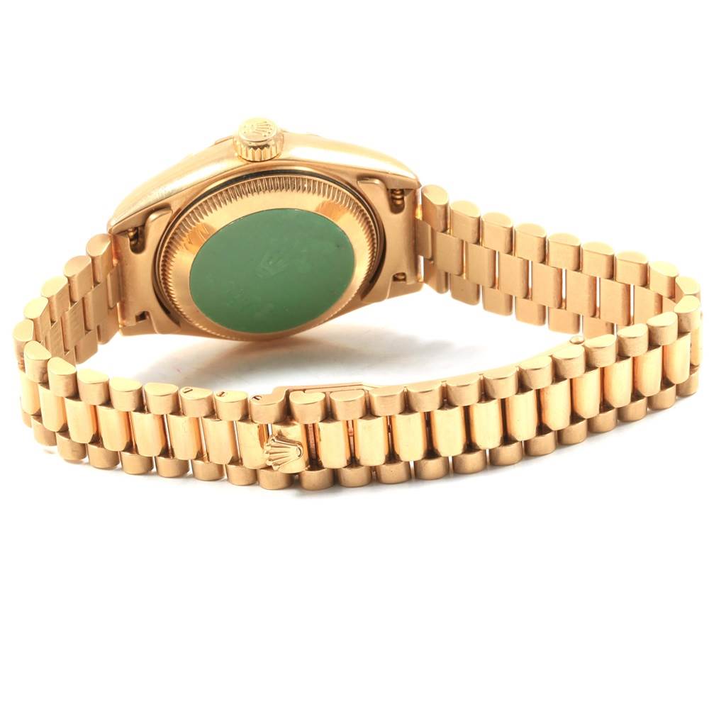 The image shows the back and band of a Rolex President 69178 Women's Yellow Gold White Dial 69178 Women's Yellow Gold White Dial model watch, featuring its case back and gold link bracelet.