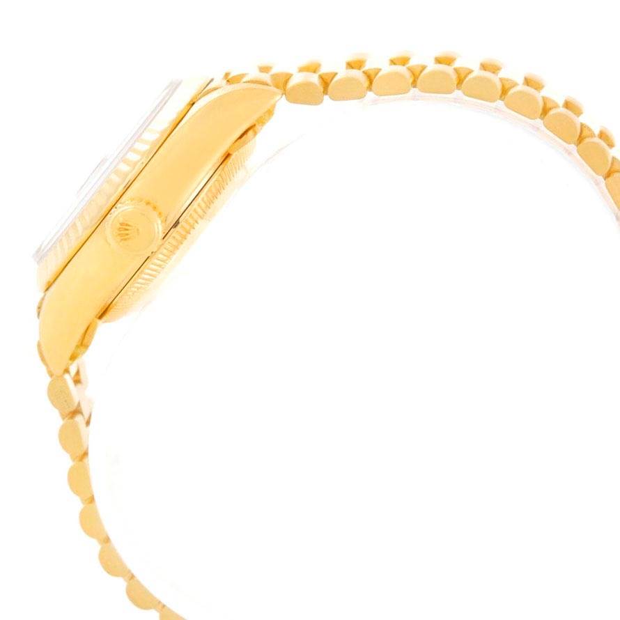 The image shows the side profile of a Rolex President 69178 Women's Yellow Gold Black Dial 69178 Women's Yellow Gold Black Dial model watch, highlighting the watch case, crown, and part of the bracelet.