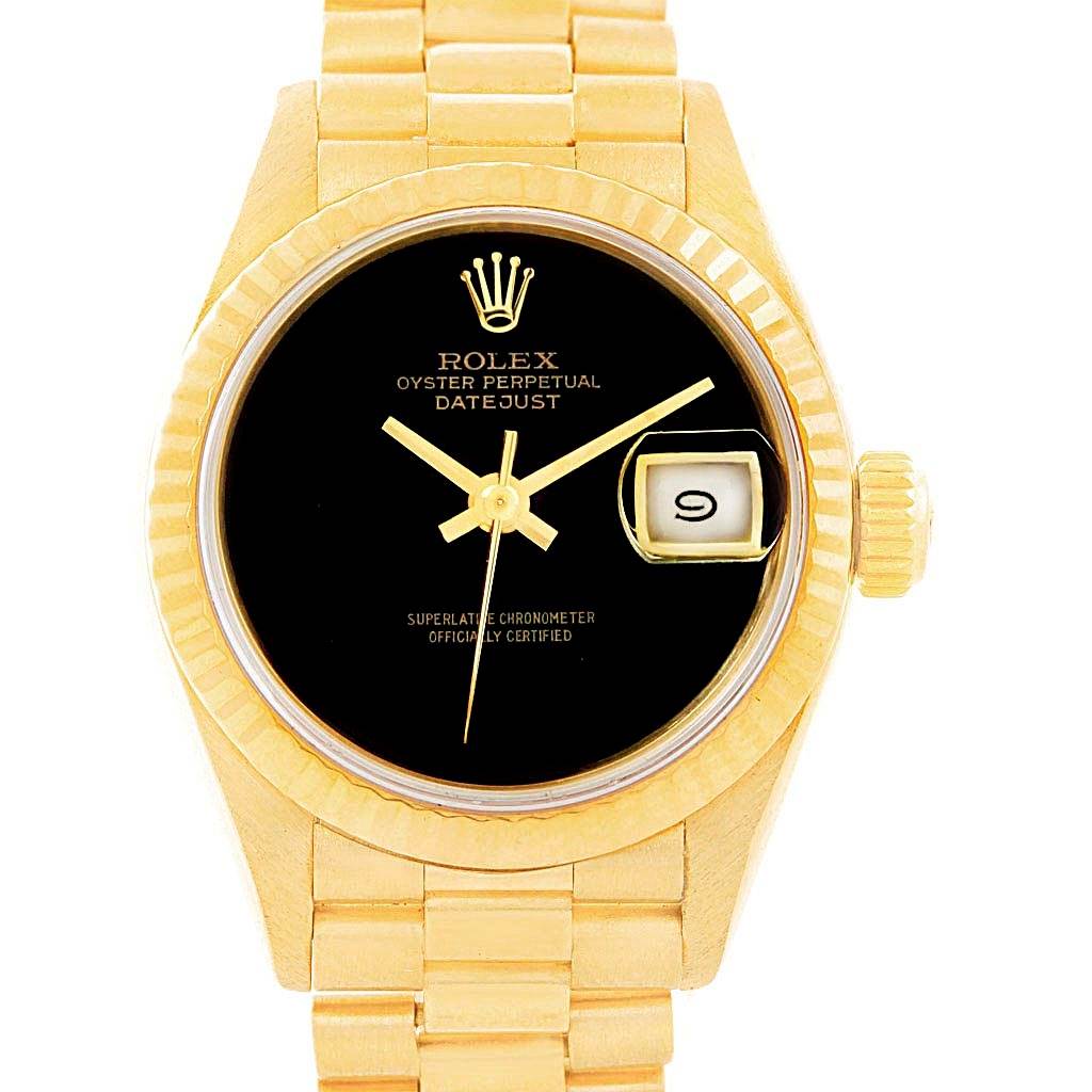 The image shows a front view of a Rolex President 69178 Women's Yellow Gold Black Dial 69178 Women's Yellow Gold Black Dial model watch, highlighting the black dial, date window, and gold band.