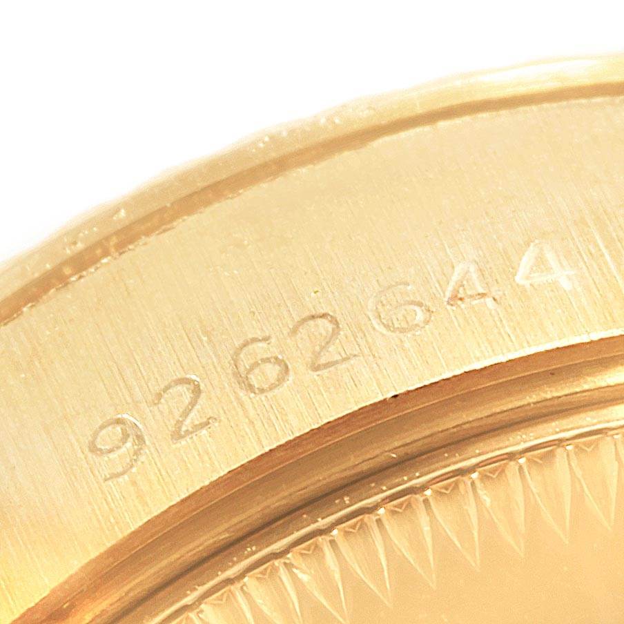 The image shows a close-up of the engraved serial number on the case of a Rolex President 69178 Women's Yellow Gold Black Dial 69178 Women's Yellow Gold Black Dial model.