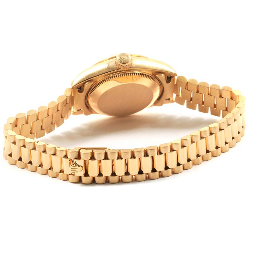 The image shows the back view and the bracelet of a Rolex President 69178 Women's Yellow Gold Black Dial 69178 Women's Yellow Gold Black Dial model watch.