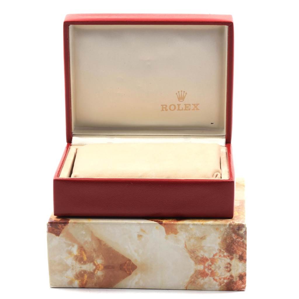 The image shows an open Rolex President 69178 Women's Yellow Gold Champagne Dial 69178 Women's Yellow Gold Champagne Dial model watch box, revealing the interior with the Rolex logo.
