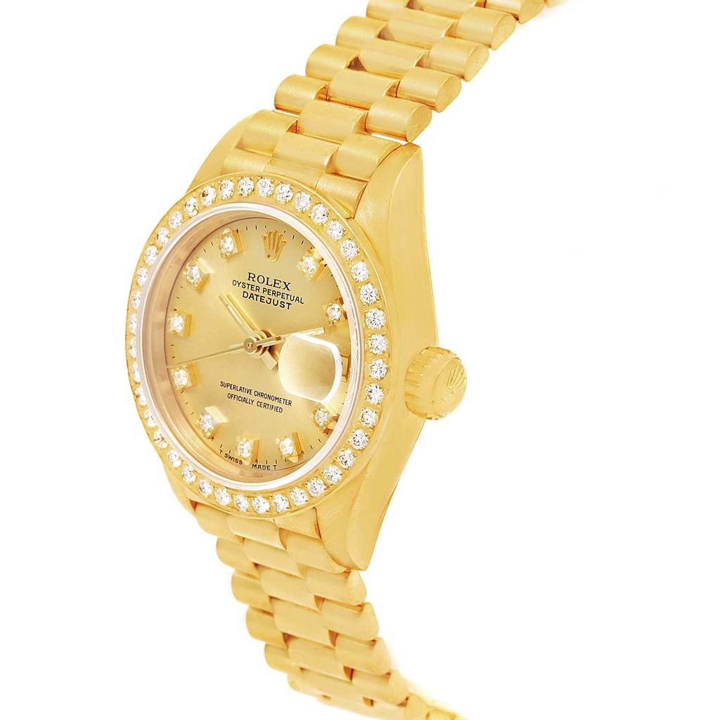 The image showcases a gold Rolex President 69178 Women's Yellow Gold Champagne Dial 69178 Women's Yellow Gold Champagne Dial model watch from an oblique angle highlighting the dial, bezel, and part of the bracelet.