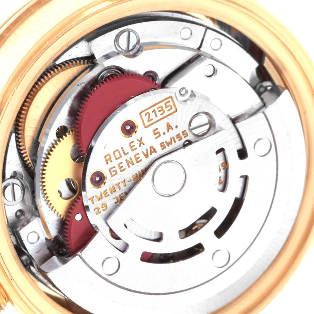 This image shows the internal movement mechanism of the Rolex President 69178 Women's Yellow Gold Champagne Dial 69178 Women's Yellow Gold Champagne Dial model watch, focusing on gears and inscriptions.