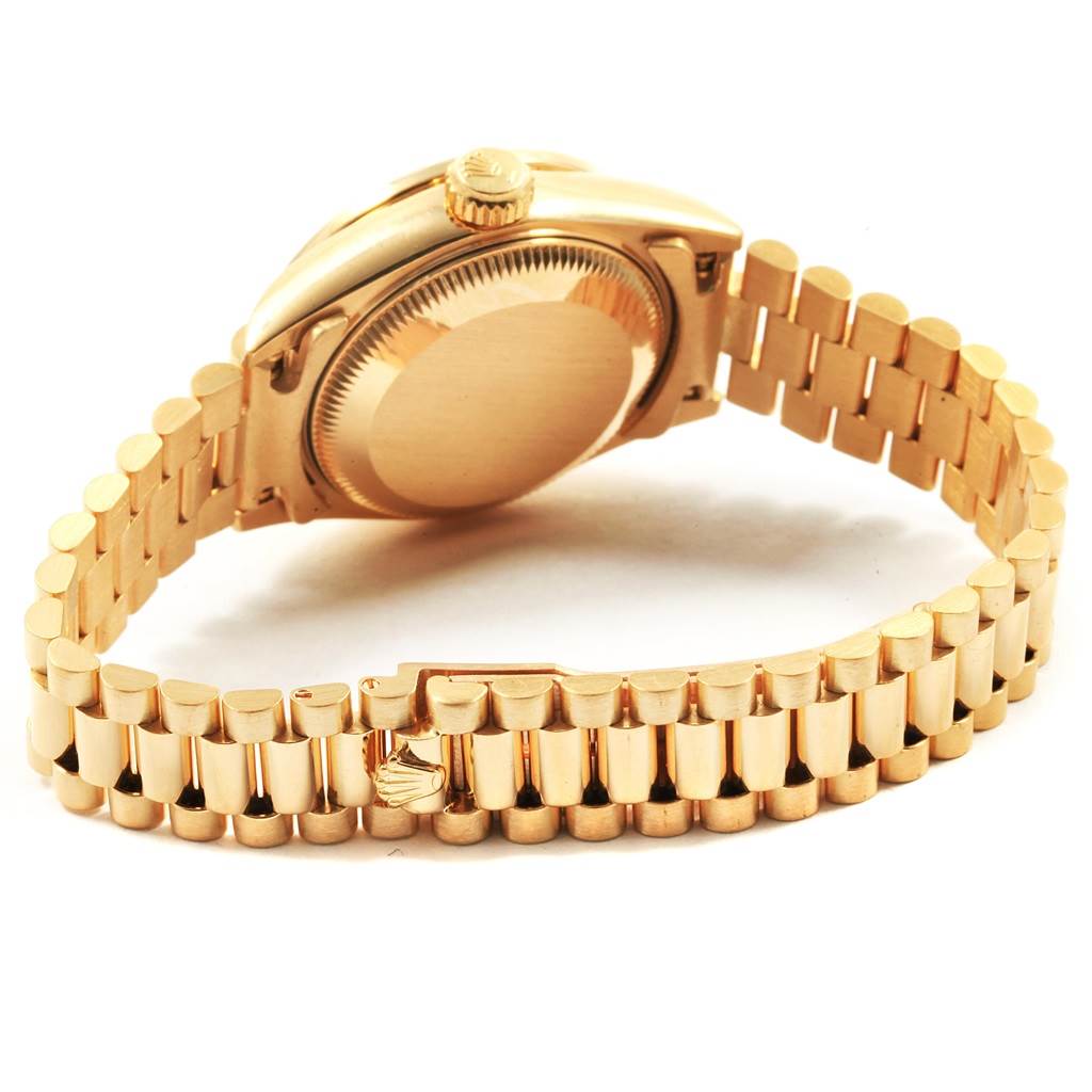 This image shows the side and back of a Rolex President 69178 Women's Yellow Gold Champagne Dial 69178 Women's Yellow Gold Champagne Dial model watch, highlighting the bracelet and case back.