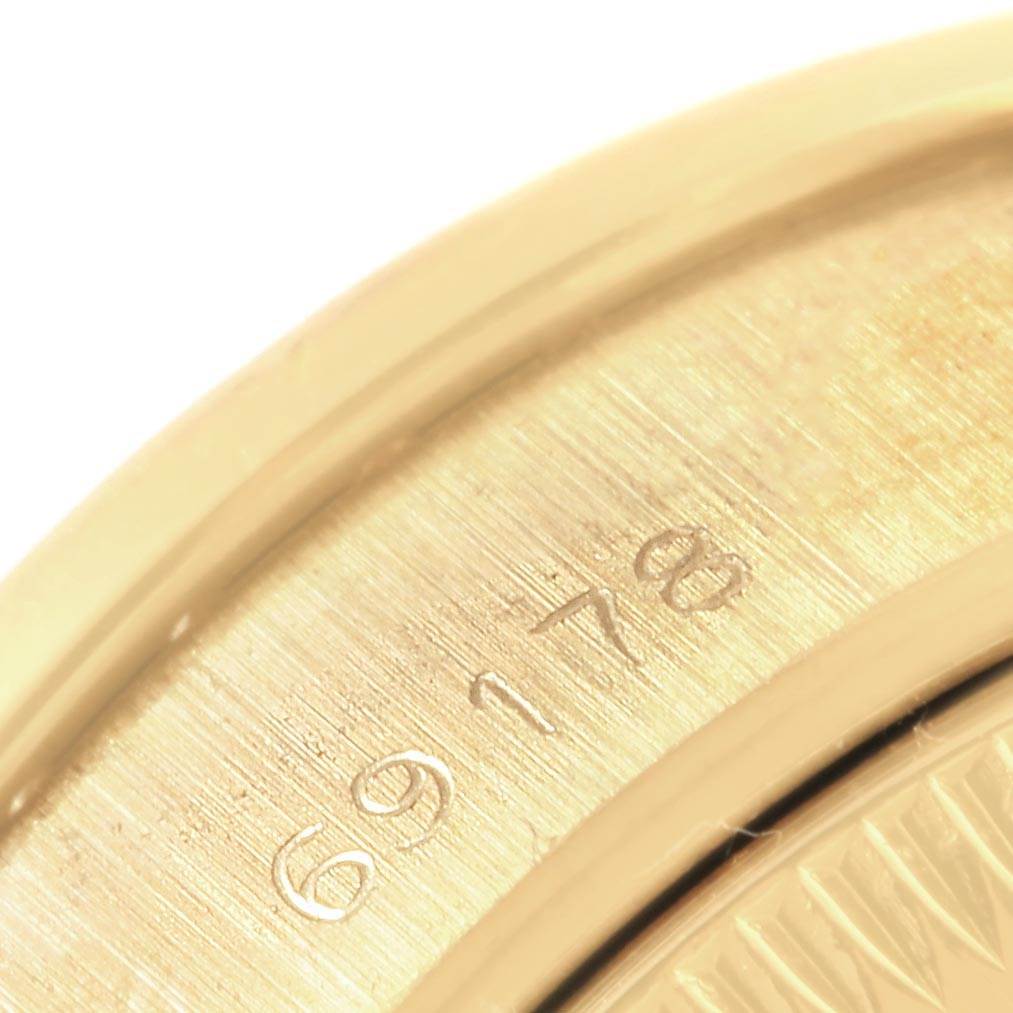 This close-up image shows the engraved serial number on the back case of the Rolex President 69178 Women's Yellow Gold Champagne Dial 69178 Women's Yellow Gold Champagne Dial model watch.