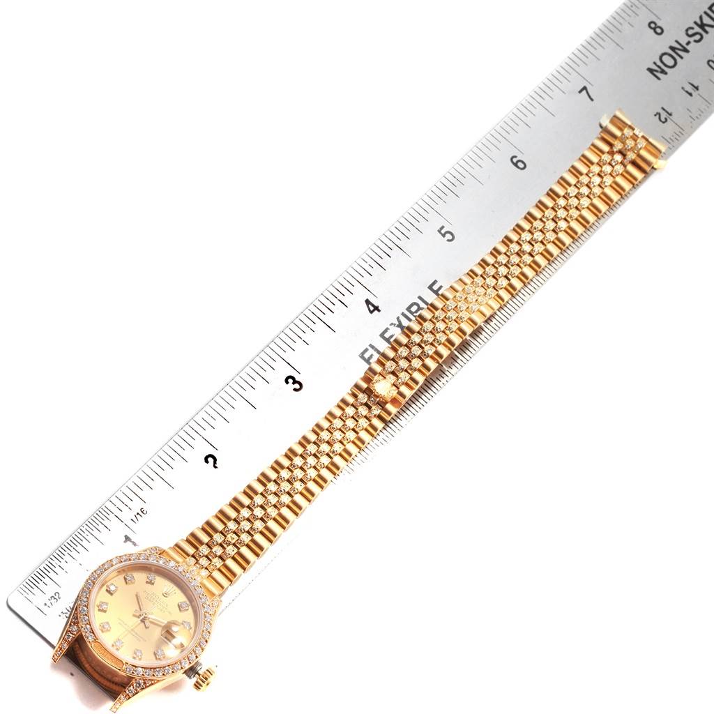 The image shows a Rolex President 69158 Women's Yellow Gold Champagne Dial 69158 Women's Yellow Gold Champagne Dial model watch laid flat with a ruler measuring its length.