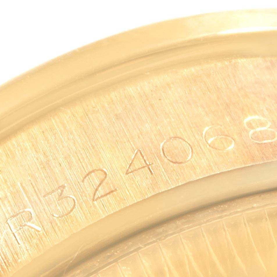 This is a close-up angle showing the serial number engraving on the back casing of the Rolex President 69158 Women's Yellow Gold Champagne Dial 69158 Women's Yellow Gold Champagne Dial model watch.