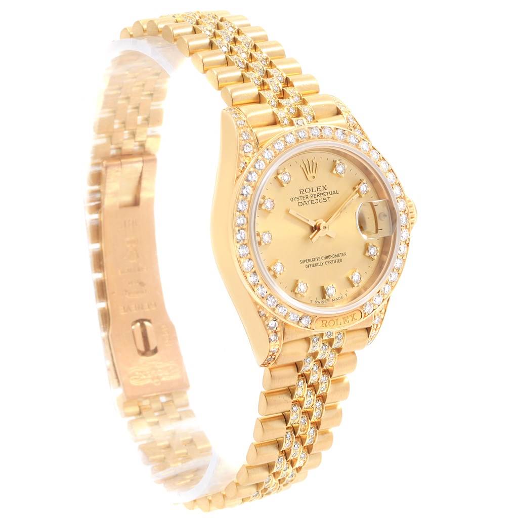 The Rolex President 69158 Women's Yellow Gold Champagne Dial 69158 Women's Yellow Gold Champagne Dial watch is shown at a three-quarter angle, displaying its diamond-studded bezel and gold bracelet.