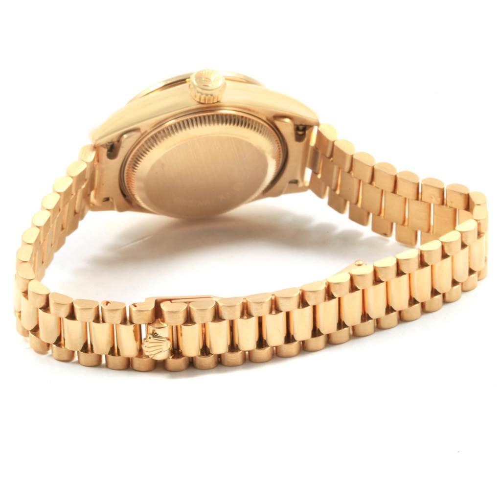 The image shows the backside and bracelet of a Rolex President 69068 Women's Yellow Gold Champagne Dial 69068 Women's Yellow Gold Champagne Dial watch, highlighting its gold finish and clasp.