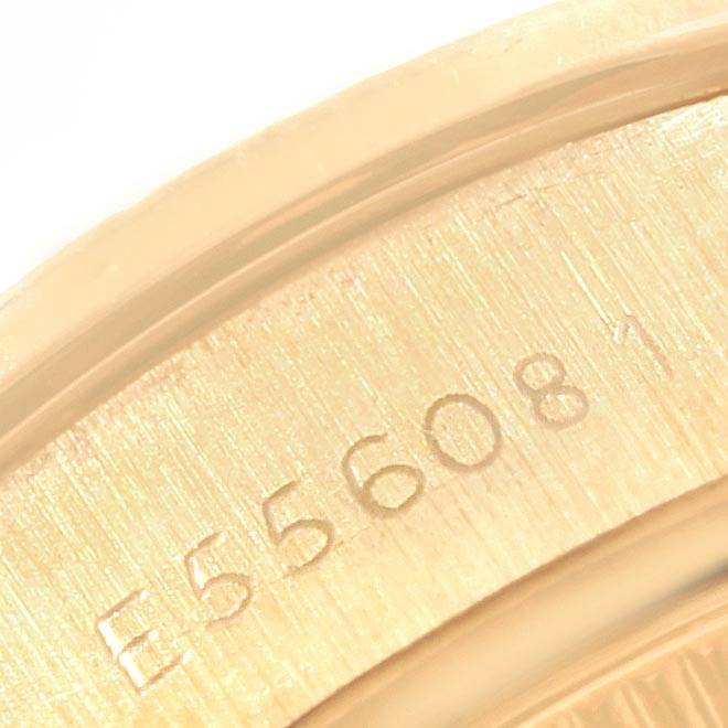 This image shows a close-up of the serial number engraving on the case back of the Rolex President 69068 Women's Yellow Gold Champagne Dial 69068 Women's Yellow Gold Champagne Dial model watch.