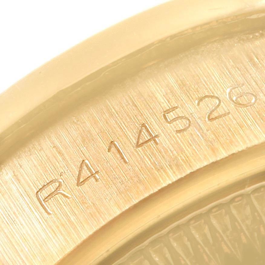 This close-up image shows the engraved reference number inside the bezel or case of a Rolex President 69138 Women
s Yellow Gold Black Dial 69138 Women
s Yellow Gold Black Dial model watch.