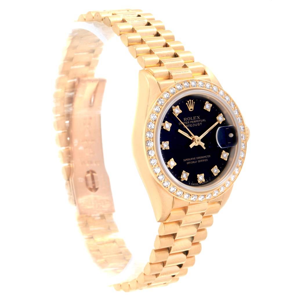 This image shows a side angle of the Rolex President 69138 Women
s Yellow Gold Black Dial 69138 Women
s Yellow Gold Black Dial model watch, highlighting its gold case, black dial, diamond markers, and bracelet.