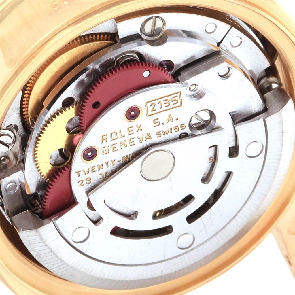 This is an internal close-up view of the Rolex President 69138 Women
s Yellow Gold Black Dial 69138 Women
s Yellow Gold Black Dial watch, showcasing its mechanical movement and gears.