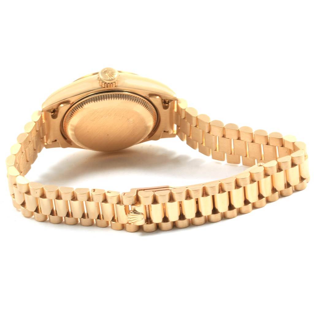 The image shows the back view of a Rolex President 69178 Women's Yellow Gold White Dial 69178 Women's Yellow Gold White Dial model watch, highlighting its case back and the iconic bracelet.