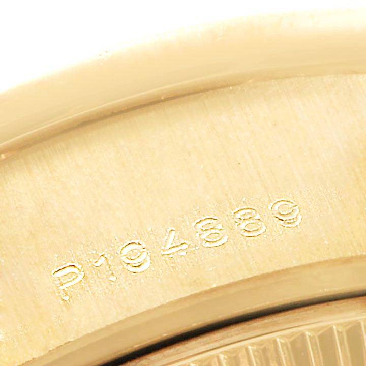 The image shows a close-up of the serial number engraved on the case of a Rolex President 79088 Women
s Yellow Gold Mother of Pearl Dial 79088 Women
s Yellow Gold Mother of Pearl Dial model watch.