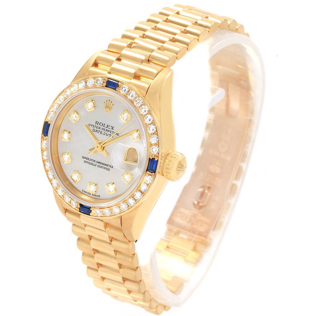 The Rolex President 79088 Women
s Yellow Gold Mother of Pearl Dial 79088 Women
s Yellow Gold Mother of Pearl Dial model watch is shown at an angle displaying its face, bezel, crown, and bracelet.