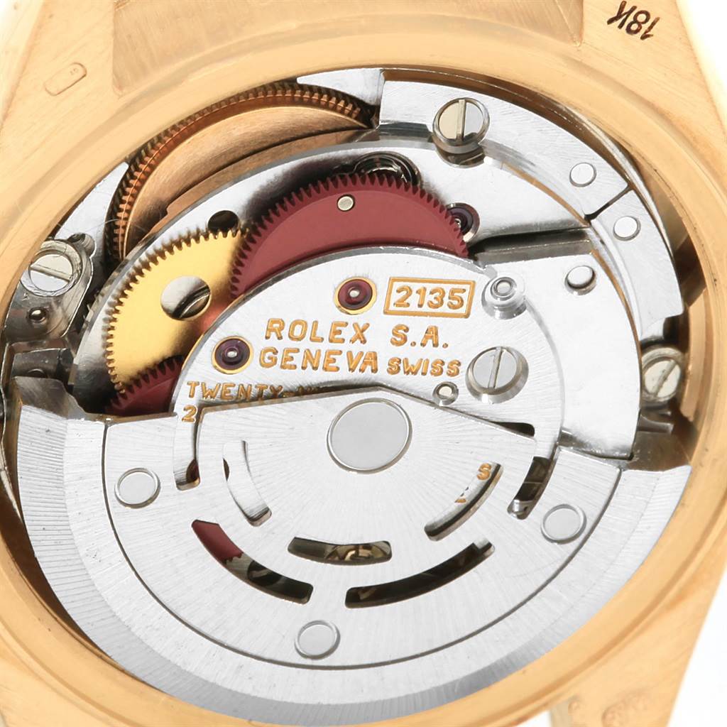This image shows a close-up view of the intricate mechanical movements of a Rolex President 69138 Women
s Yellow Gold Champagne Dial 69138 Women
s Yellow Gold Champagne Dial model watch.