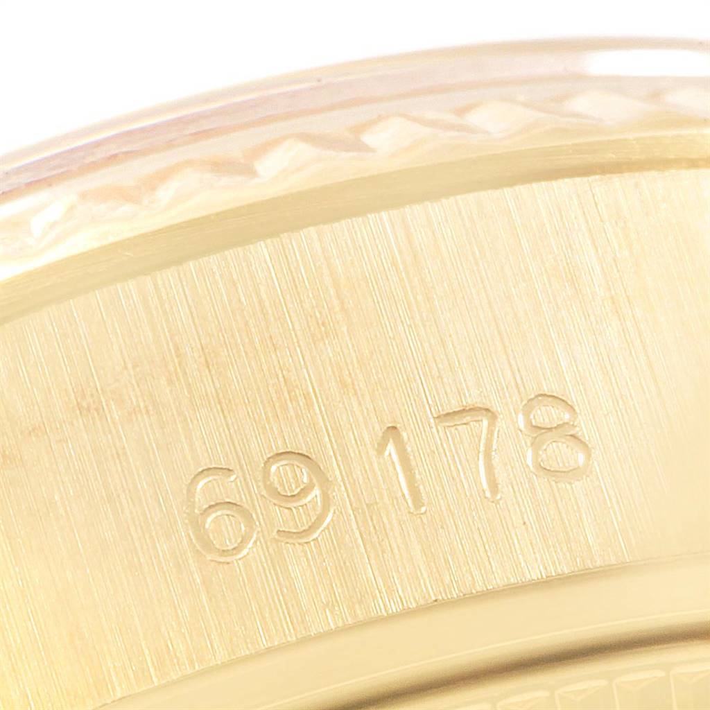 This image shows a close-up of the serial or model number "69178" engraved on the side of a Rolex President 69178 Women
s Yellow Gold Champagne Dial 69178 Women
s Yellow Gold Champagne Dial watch.