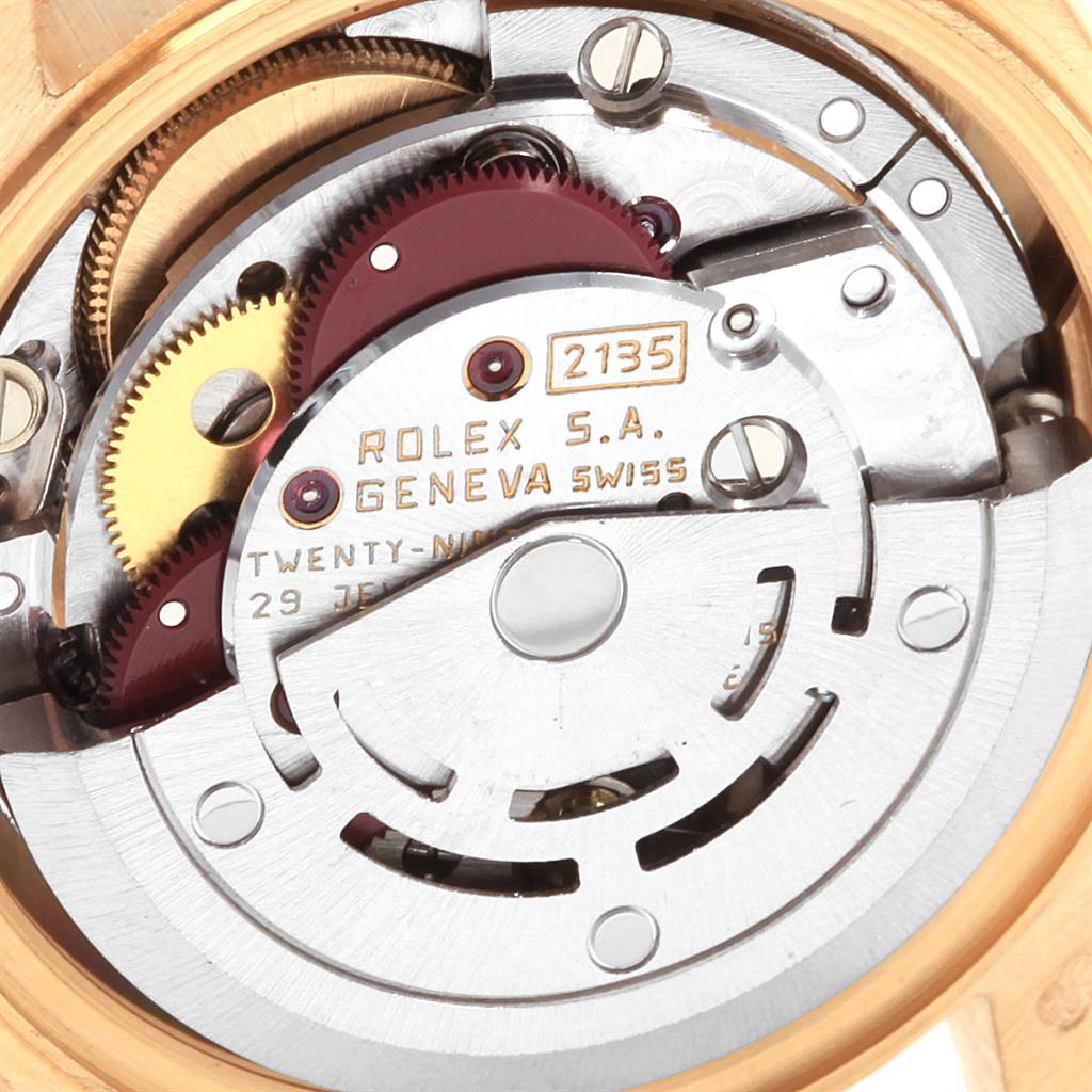 This image shows a close-up of the Rolex President 69178 Women
s Yellow Gold Champagne Dial 69178 Women
s Yellow Gold Champagne Dial model
s movement components, including gears and the oscillating weight.
