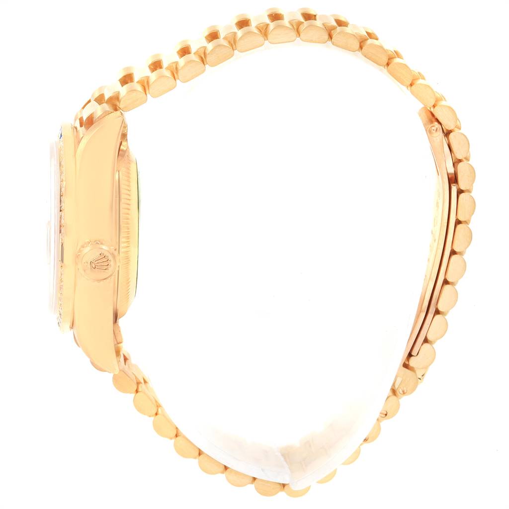 This image shows a side angle of the Rolex President 79088 Women's Yellow Gold Mother of Pearl Dial 79088 Women's Yellow Gold Mother of Pearl Dial model watch, highlighting the bezel, crown, and part of the bracelet.