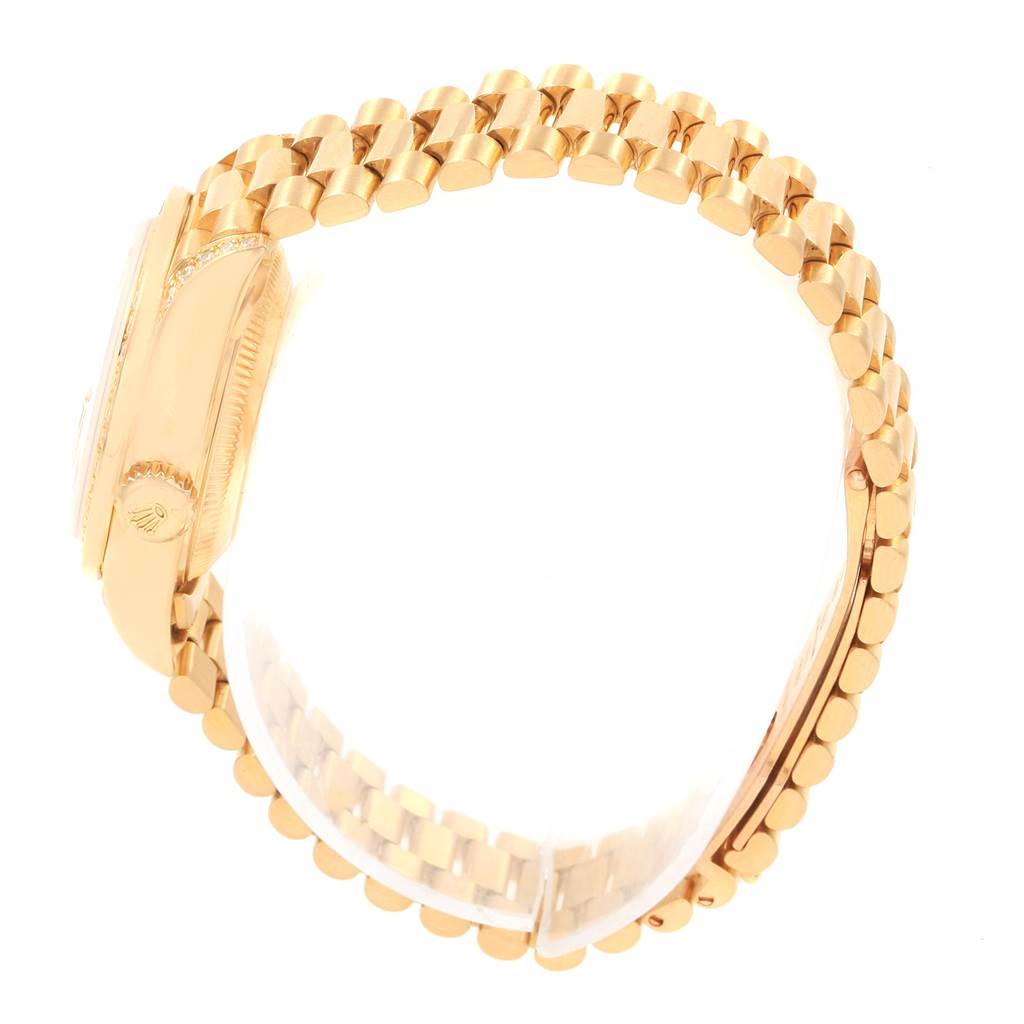 The image shows a side view of the Rolex President 79188 Women
s Yellow Gold Champagne Dial 79188 Women
s Yellow Gold Champagne Dial model, highlighting its gold link bracelet and case.