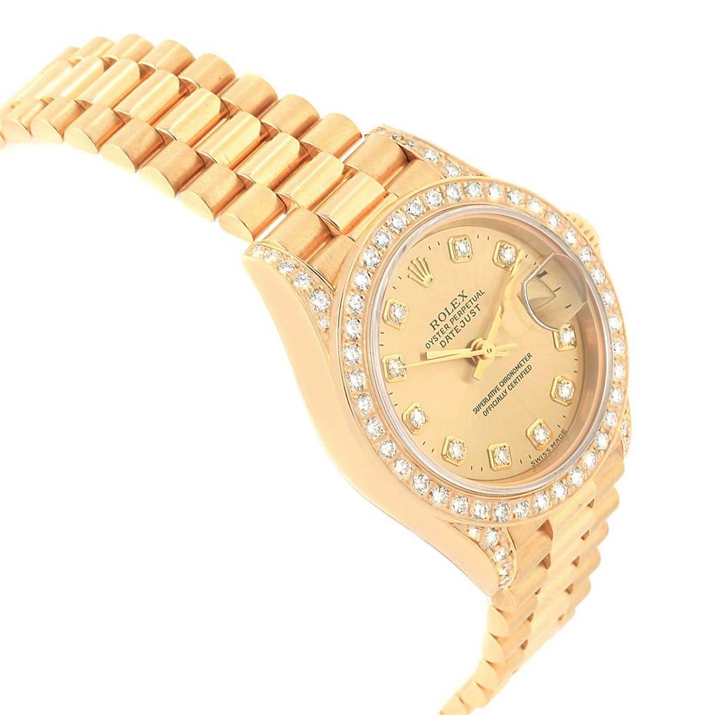 This image shows a Rolex President 79188 Women
s Yellow Gold Champagne Dial 79188 Women
s Yellow Gold Champagne Dial model watch from an angled perspective, highlighting its diamond bezel, dial, and bracelet.