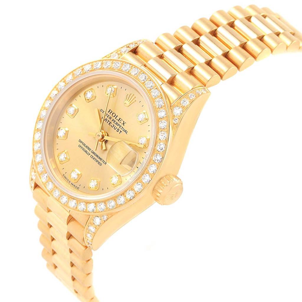 The image shows a Rolex President 79188 Women
s Yellow Gold Champagne Dial 79188 Women
s Yellow Gold Champagne Dial model watch at a three-quarter angle, highlighting the face, bezel, crown, and part of the bracelet.