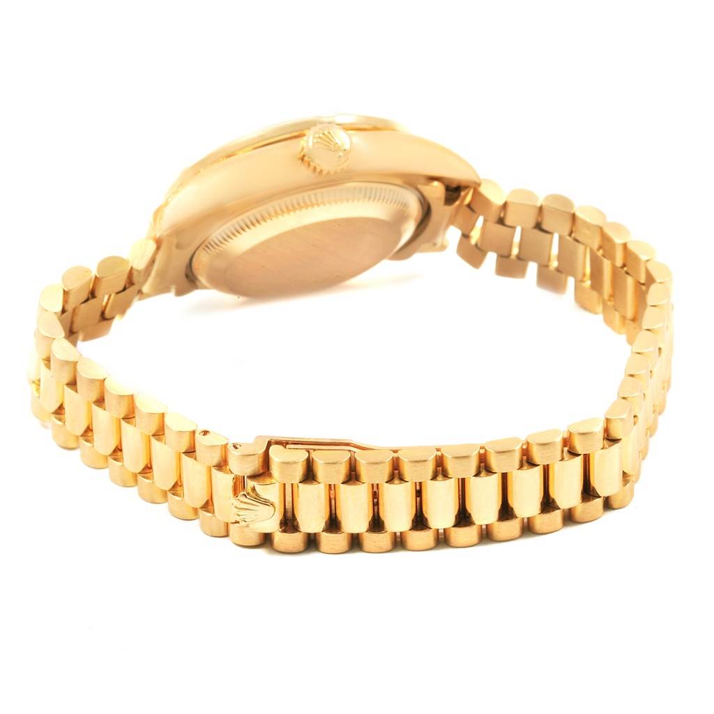 The image shows the back and side view of a Rolex President 79188 Women
s Yellow Gold Champagne Dial 79188 Women
s Yellow Gold Champagne Dial model watch, highlighting its gold case and bracelet.