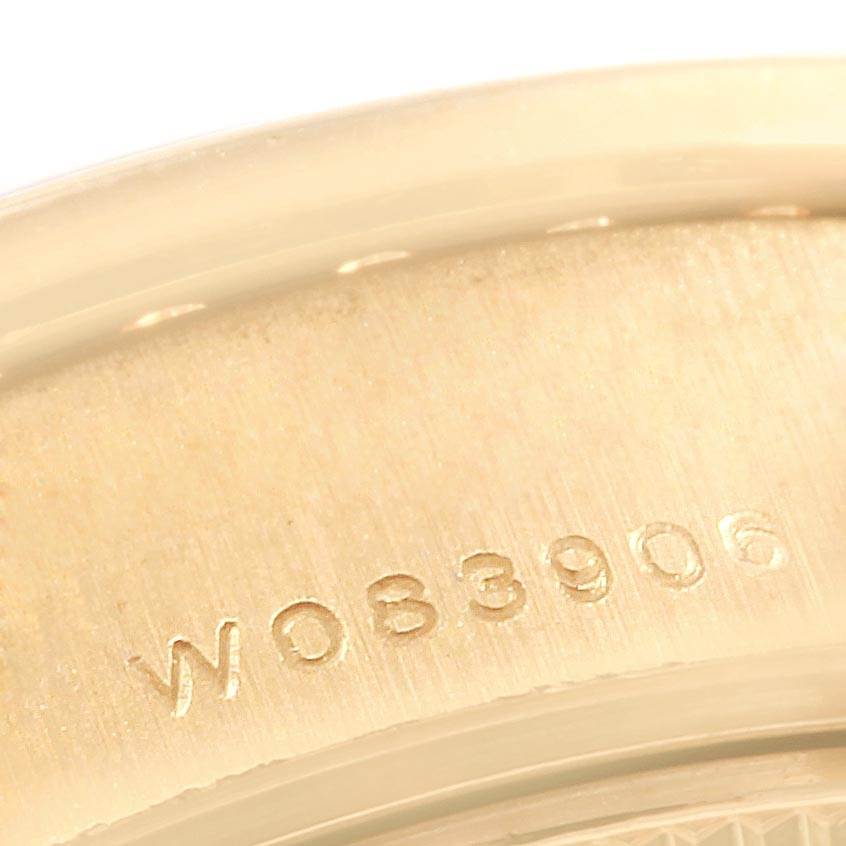 The image shows a close-up view of the serial number engraving on the case back of a Rolex President 79188 Women
s Yellow Gold Champagne Dial 79188 Women
s Yellow Gold Champagne Dial model watch.