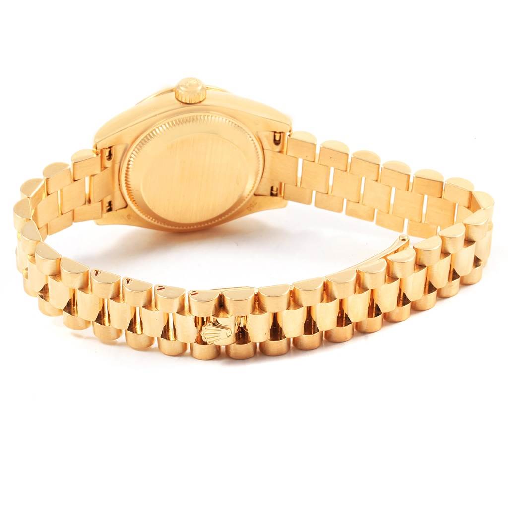 This image shows the back and bracelet of a Rolex President 179138 Women's Yellow Gold Mother of Pearl Dial 179138 Women's Yellow Gold Mother of Pearl Dial model watch, highlighting the clasp and case back.